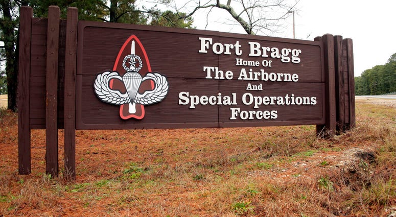 FILE - In this Jan. 4, 2020, file photo a sign for at Fort Bragg, N.C., is shown. A female soldier has graduated from the Army’s elite Special Forces course and will for the first time join one of the all-male Green Beret teams. (