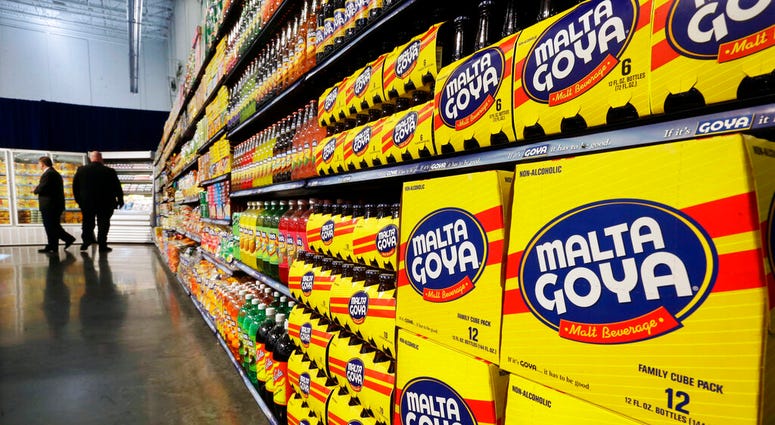FILE - In this April 29, 2015, file photo, people walk past displays of Goya Foods products at the new corporate headquarters in Jersey City, N.J.