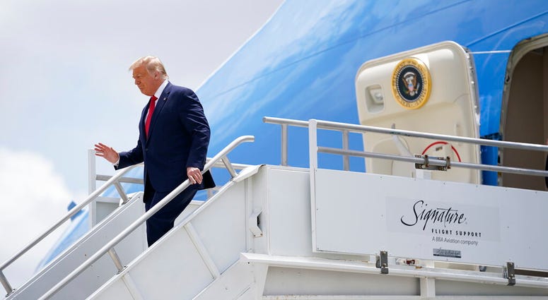 President Donald Trump exits Air Force One at Miami International Airport on Friday, July 10, 2020.