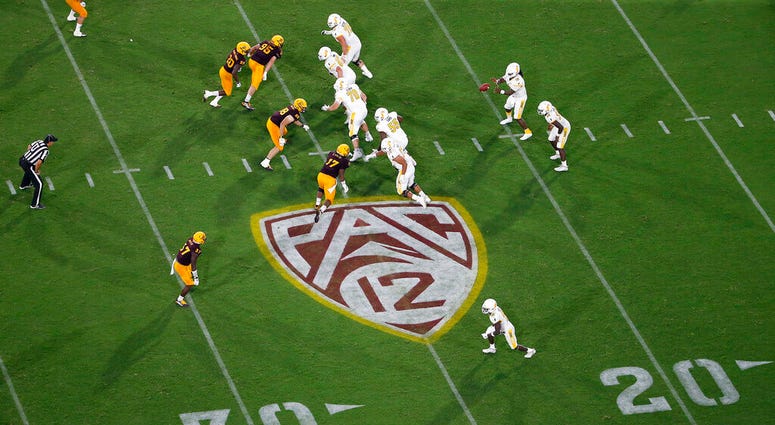 FILE - This Thursday, Aug. 29, 2019, file photo, shows the Pac-12 logo during the second half of an NCAA college football game between Arizona State and Kent State, in Tempe, Ariz.