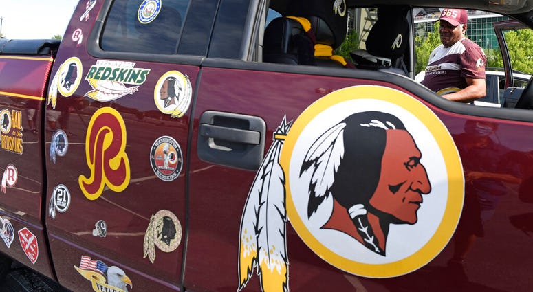 Rodney Johnson of Chesapeake, Va., stands with his truck outside FedEx Field in Landover, Md., Monday, July 13, 2020.