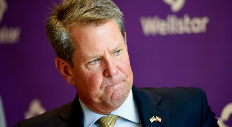 Georgia Gov. Brian Kemp prepares to sign House and Senate bills at Wellstar Kennestone Hospital where the hospital opened a new Emergency Room space, Thursday, July 16, 2020, in Marietta, Ga.