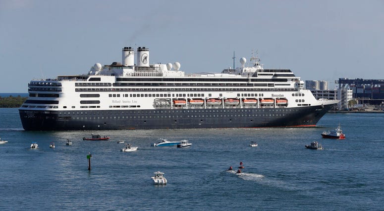 FILE - The cruise ship Rotterdam turns as it prepares to dock at Port Everglades, Thursday, April 2, 2020, in Fort Lauderdale, Fla.