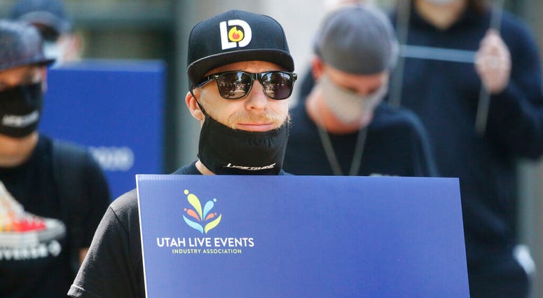 Special events workers who were forced out of work because of the COVID-19 pandemic marched Tuesday, July 21, 2020, in Salt Lake City.
