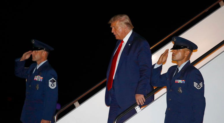 President Donald Trump steps off Air Force One at Andrews Air Force Base, Md., Friday, July 31, 2020. Trump is returning to Washington after attending events in Florida.