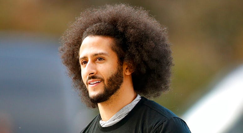 FILE - In this Nov. 16, 2019, file photo, free agent quarterback Colin Kaepernick arrives for a workout for NFL football scouts and media in Riverdale, Ga. (AP Photo/Todd Kirkland, File) FILE - In this Nov. 16, 2019, file photo, free agent quarterback Colin Kaepernick arrives for a workout for NFL football scouts and media in Riverdale, Ga. (AP Photo/Todd Kirkland, File)