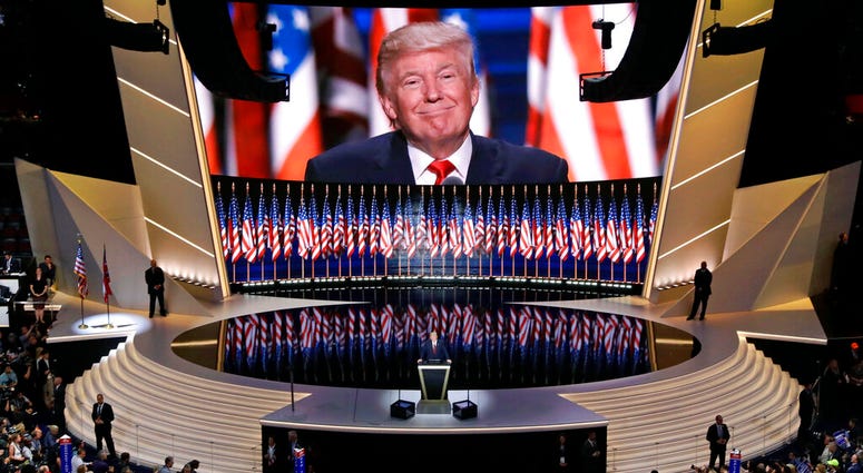 FILE - In this July 21, 2016, file photo, Republican presidential candidate Donald Trump smiles as he addresses delegates during the final day session of the Republican National Convention in Cleveland.