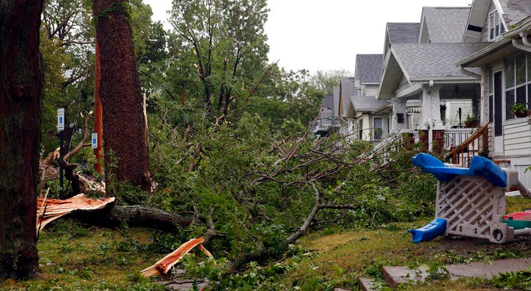 Downed trees and other debris cover front yards in Cedar Rapids, Iowa, after a powerful storm moved through Iowa on Monday, Aug. 10, 2020. (Liz Martin/The Gazette via AP) Downed trees and other debris cover front yards in Cedar Rapids, Iowa, after a powerful storm moved through Iowa on Monday, Aug. 10, 2020. (Liz Martin/The Gazette via AP)