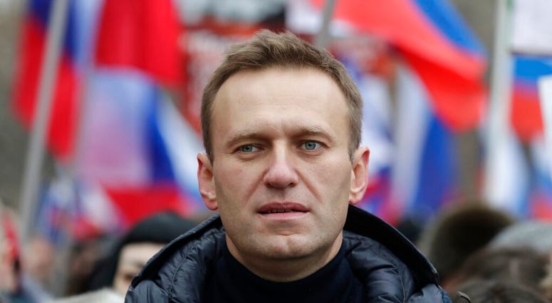 In this Sunday, Feb. 24, 2019 file photo, Russian opposition activist Alexei Navalny takes part in a march in memory of opposition leader Boris Nemtsov in Moscow, Russia. (AP Photo/Pavel Golovkin, File) In this Sunday, Feb. 24, 2019 file photo, Russian opposition activist Alexei Navalny takes part in a march in memory of opposition leader Boris Nemtsov in Moscow, Russia. (AP Photo/Pavel Golovkin, File)