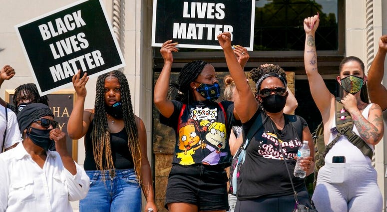 A small group of Black Lives Matter protesters hold a rally on the steps of the Kenosha County courthouse Monday, Aug. 24, 2020, in Kenosha, Wis. (AP Photo/Morry Gash) A small group of Black Lives Matter protesters hold a rally on the steps of the Kenosha County courthouse Monday, Aug. 24, 2020, in Kenosha, Wis. (AP Photo/Morry Gash)