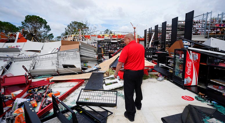 An auto parts store employee surveys the damage to the facilty on Thursday, Aug. 27, 2020, in Lake Charles, La., in the aftermath of Hurricane Laura. (AP Photo/Gerald Herbert) An auto parts store employee surveys the damage to the facilty on Thursday, Aug. 27, 2020, in Lake Charles, La., in the aftermath of Hurricane Laura. (AP Photo/Gerald Herbert)