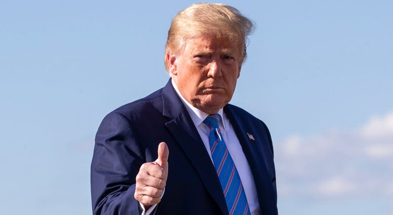 FILE - In this Sunday, June 14, 2020 file photo, President Donald Trump gives a thumbs-up while walking across the tarmac as he boards Air Force One at Morristown Municipal Airport, in Morristown, N.J. (AP Photo/Alex Brandon, File) FILE - In this Sunday, June 14, 2020 file photo, President Donald Trump gives a thumbs-up while walking across the tarmac as he boards Air Force One at Morristown Municipal Airport, in Morristown, N.J. (AP Photo/Alex Brandon, File)