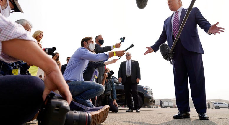 President Donald Trump speaks to reporters as he arrives at Sacramento McClellan Airport, in McClellan Park, Calif., Monday, Sept. 14, 2020, for a briefing on wildfires. (AP Photo/Andrew Harnik) President Donald Trump speaks to reporters as he arrives at Sacramento McClellan Airport, in McClellan Park, Calif., Monday, Sept. 14, 2020, for a briefing on wildfires. (AP Photo/Andrew Harnik)