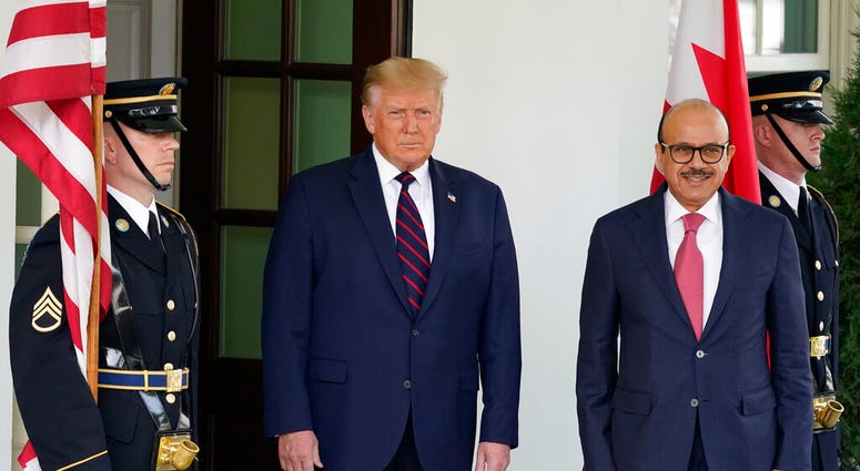President Donald Trump greets the Bahrain Foreign Minister Khalid bin Ahmed Al Khalifa at the White House, Tuesday, Sept. 15, 2020, in Washington. (AP Photo/Alex Brandon) President Donald Trump greets the Bahrain Foreign Minister Khalid bin Ahmed Al Khalifa at the White House, Tuesday, Sept. 15, 2020, in Washington. (AP Photo/Alex Brandon)