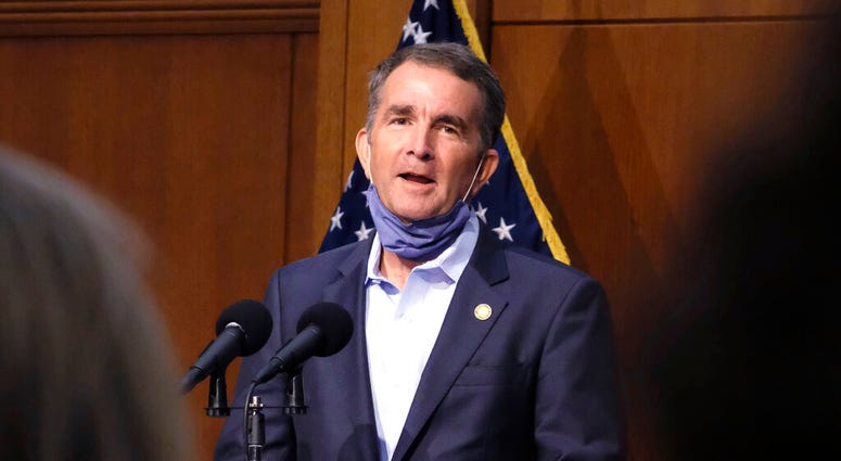 Virginia Gov. Ralph Northam answers a reporter's question during a press briefing inside the Patrick Henry Building in Richmond, Va., Tuesday, Sept. 15, 2020. (Bob Brown/Richmond Times-Dispatch via AP) Virginia Gov. Ralph Northam answers a reporter's question during a press briefing inside the Patrick Henry Building in Richmond, Va., Tuesday, Sept. 15, 2020. (Bob Brown/Richmond Times-Dispatch via AP)