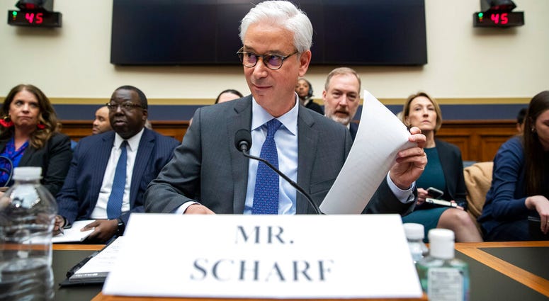FILE - In this March 10, 2020 file photo, Wells Fargo CEO and President Charles Scharf is seated before he testifies during a hearing of the House Financial Services Committee, on Capitol Hill, in Washington. (AP Photo/Alex Brandon, File) FILE - In this March 10, 2020 file photo, Wells Fargo CEO and President Charles Scharf is seated before he testifies during a hearing of the House Financial Services Committee, on Capitol Hill, in Washington. (AP Photo/Alex Brandon, File)
