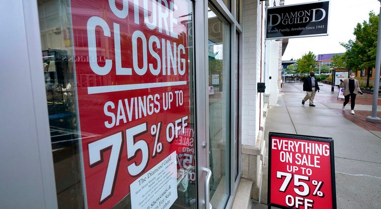 Passersby walk past a business storefront with store closing and sale signs, Wednesday, Sept. 2, 2020, in Dedham, Mass. (AP Photo/Steven Senne) Passersby walk past a business storefront with store closing and sale signs, Wednesday, Sept. 2, 2020, in Dedham, Mass. (AP Photo/Steven Senne)