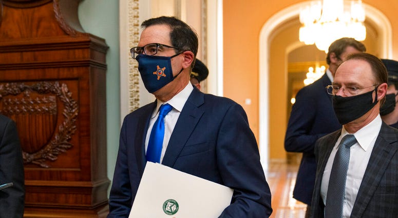 Treasury Secretary Steven Mnuchin, makes a brief comment as he leaves the Capitol, Wednesday, Sept. 30, 2020, in Washington. Mnuchin earlier met with House Speaker Nancy Pelosi of Calif. (AP Photo/Manuel Balce Ceneta) Treasury Secretary Steven Mnuchin, makes a brief comment as he leaves the Capitol, Wednesday, Sept. 30, 2020, in Washington. Mnuchin earlier met with House Speaker Nancy Pelosi of Calif. (AP Photo/Manuel Balce Ceneta)