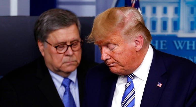 In this March 23, 2020, file photo President Donald Trump moves from the podium to allow Attorney General William Barr to speak about the coronavirus in the James Brady Briefing Room in Washington. (AP Photo/Alex Brandon, File) In this March 23, 2020, file photo President Donald Trump moves from the podium to allow Attorney General William Barr to speak about the coronavirus in the James Brady Briefing Room in Washington. (AP Photo/Alex Brandon, File)