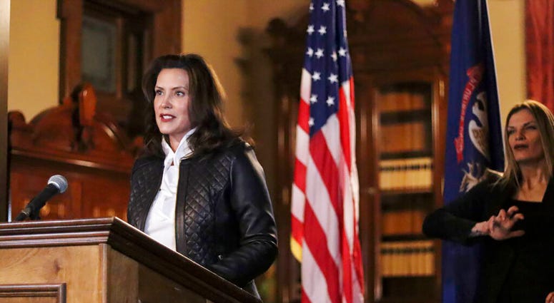 In a photo provided by the Michigan Office of the Governor, Michigan Gov. Gretchen Whitmer addresses the state during a speech in Lansing, Mich., Thursday, Oct. 8, 2020. (Michigan Office of the Governor via AP) In a photo provided by the Michigan Office of the Governor, Michigan Gov. Gretchen Whitmer addresses the state during a speech in Lansing, Mich., Thursday, Oct. 8, 2020. (Michigan Office of the Governor via AP)