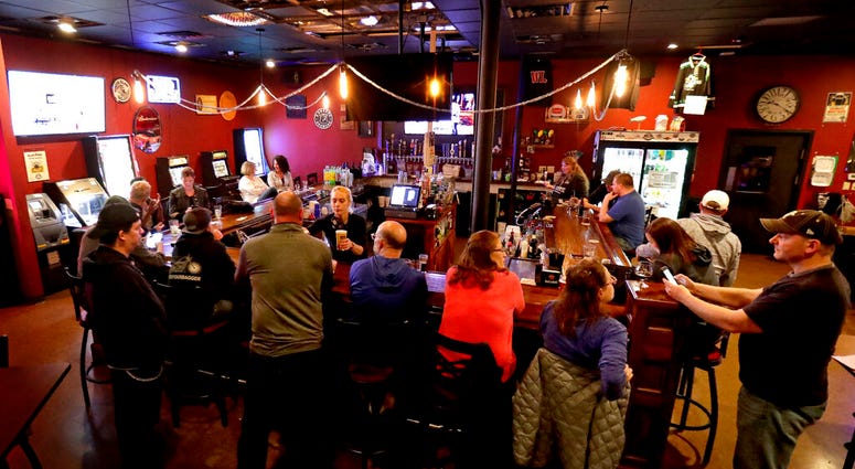 In this May 13, 2020 file photo, The Dairyland Brew Pub opens to patrons in Appleton, Wis. (William Glasheen/The Post-Crescent via AP File) In this May 13, 2020 file photo, The Dairyland Brew Pub opens to patrons in Appleton, Wis. (William Glasheen/The Post-Crescent via AP File)