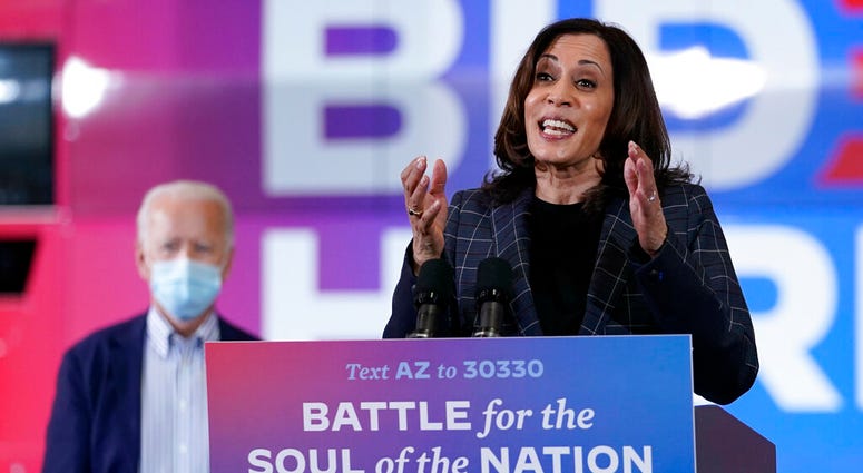 In this Oct. 8, 2020, photo, Democratic vice presidential candidate Sen. Kamala Harris, D-Calif., speaks at Carpenters Local Union 1912 in Phoenix, as Democratic presidential candidate former vice president Joe Biden listens. (AP Photo/Carolyn Kaster) In this Oct. 8, 2020, photo, Democratic vice presidential candidate Sen. Kamala Harris, D-Calif., speaks at Carpenters Local Union 1912 in Phoenix, as Democratic presidential candidate former vice president Joe Biden listens. (AP Photo/Carolyn Kaster)