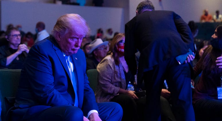 President Donald Trump prepares his offering as he attends church at International Church of Las Vegas, Sunday, Oct. 18, 2020, in Las Vegas, Nev. (AP Photo/Alex Brandon) President Donald Trump prepares his offering as he attends church at International Church of Las Vegas, Sunday, Oct. 18, 2020, in Las Vegas, Nev. (AP Photo/Alex Brandon)