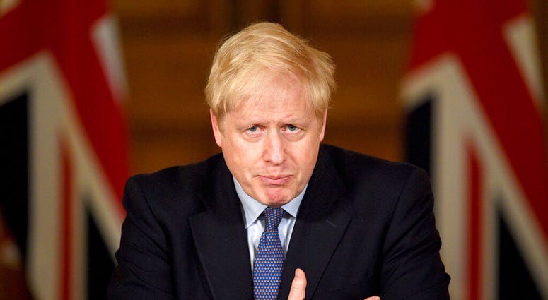 Britain's Prime Minister Boris Johnson speaks, during a coronavirus media briefing in Downing Street, London, Tuesday, Oct. 20, 2020. (Leon Neal/Pool Photo via AP) Britain's Prime Minister Boris Johnson speaks, during a coronavirus media briefing in Downing Street, London, Tuesday, Oct. 20, 2020. (Leon Neal/Pool Photo via AP)