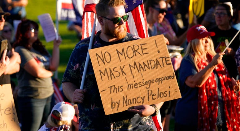 In this Sept. 5, 2020, file photo, people gather during a "Trash Your Mask Protest" rally hosted by the Utah Business Revival at the Utah State Capitol in Salt Lake City. (AP Photo/Rick Bowmer, File) In this Sept. 5, 2020, file photo, people gather during a "Trash Your Mask Protest" rally hosted by the Utah Business Revival at the Utah State Capitol in Salt Lake City. (AP Photo/Rick Bowmer, File)