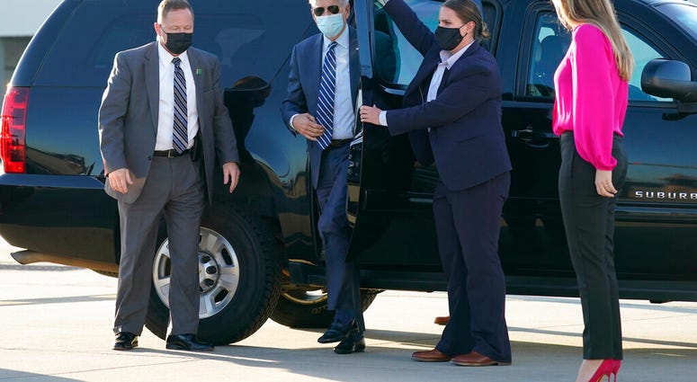 In this Oct. 18, 2020, photo, Democratic presidential candidate former Vice President Joe Biden steps out to board his campaign plane at Raleigh-Durham International Airport in Morrisville, N.C. (AP Photo/Carolyn Kaster) In this Oct. 18, 2020, photo, Democratic presidential candidate former Vice President Joe Biden steps out to board his campaign plane at Raleigh-Durham International Airport in Morrisville, N.C. (AP Photo/Carolyn Kaster)