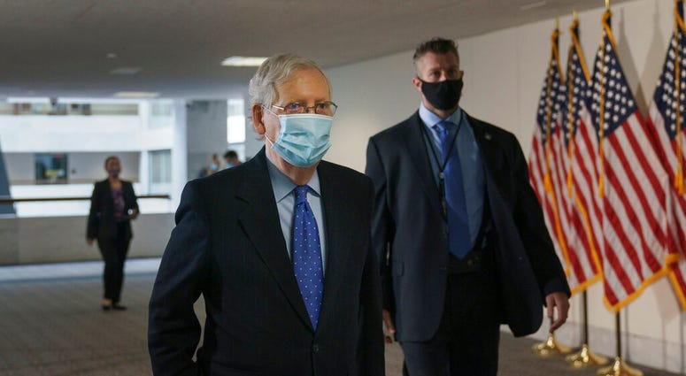 Senate Majority Leader Mitch McConnell, R-Ky., arrives for a closed-door meeting with Senate Republicans, on Capitol Hill in Washington, Friday, Oct. 23, 2020. (AP Photo/J. Scott Applewhite) Senate Majority Leader Mitch McConnell, R-Ky., arrives for a closed-door meeting with Senate Republicans, on Capitol Hill in Washington, Friday, Oct. 23, 2020. (AP Photo/J. Scott Applewhite)