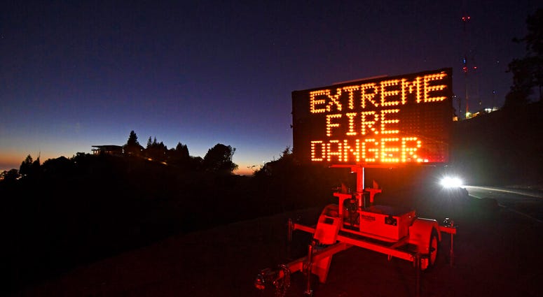 A roadside sign warns motorists of extreme fire danger on Grizzly Peak Boulevard, in Oakland, Calif., Sunday, Oct. 25, 2020. (Jose Carlos Fajardo/Bay Area News Group via AP) A roadside sign warns motorists of extreme fire danger on Grizzly Peak Boulevard, in Oakland, Calif., Sunday, Oct. 25, 2020. (Jose Carlos Fajardo/Bay Area News Group via AP)