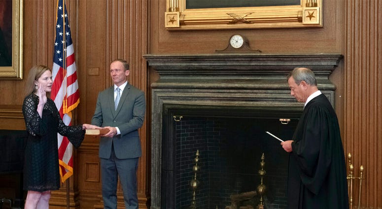 Chief Justice John G. Roberts, Jr., right, administers the Judicial Oath to Judge Amy Coney Barrett in the East Conference Room of the Supreme Court Building, Tuesday, Oct. 27, 2020, in Washington. Chief Justice John G. Roberts, Jr., right, administers the Judicial Oath to Judge Amy Coney Barrett in the East Conference Room of the Supreme Court Building, Tuesday, Oct. 27, 2020, in Washington.