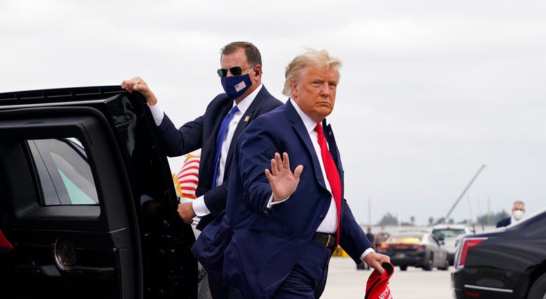 President Donald Trump arrives to board Air Force One for a day of campaign rallies, Monday, Nov. 2, 2020, in Miami. (AP Photo/Evan Vucci) President Donald Trump arrives to board Air Force One for a day of campaign rallies, Monday, Nov. 2, 2020, in Miami. (AP Photo/Evan Vucci)