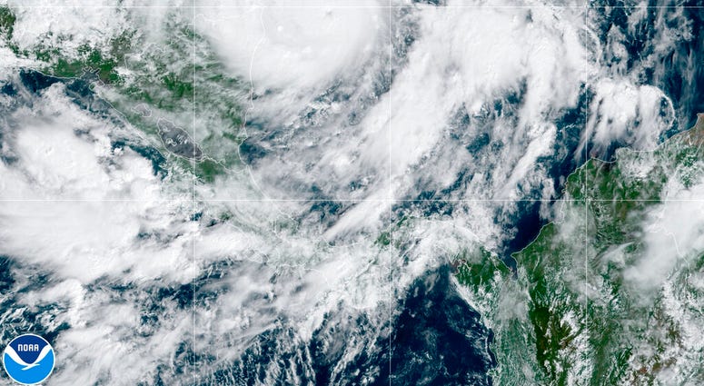 This GeoColor satellite image taken Monday, Nov. 2, 2020, at 1 p.m. EDT, and provided by NOAA, shows Hurricane Eta in the Gulf of Mexico approaching the border of Honduras and Nicaragua. (NOAA via AP) This GeoColor satellite image taken Monday, Nov. 2, 2020, at 1 p.m. EDT, and provided by NOAA, shows Hurricane Eta in the Gulf of Mexico approaching the border of Honduras and Nicaragua. (NOAA via AP)