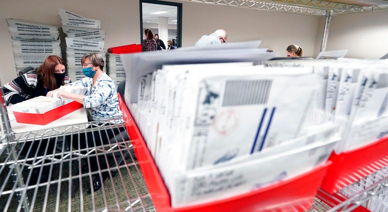 In this Nov. 5, 2020, photo, Lehigh County workers count ballots as vote counting in the general election continues in Allentown, Pa. (AP Photo/Mary Altaffer) In this Nov. 5, 2020, photo, Lehigh County workers count ballots as vote counting in the general election continues in Allentown, Pa. (AP Photo/Mary Altaffer)