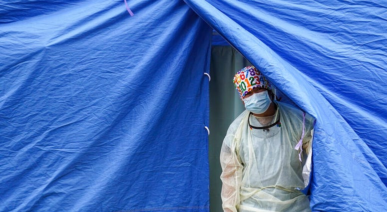 In this Nov. 11, 2020, file photo, medical works operate a testing tent at a COVID-19 mobile testing site in the Brooklyn borough of New York. (AP Photo/John Minchillo, File) In this Nov. 11, 2020, file photo, medical works operate a testing tent at a COVID-19 mobile testing site in the Brooklyn borough of New York. (AP Photo/John Minchillo, File)