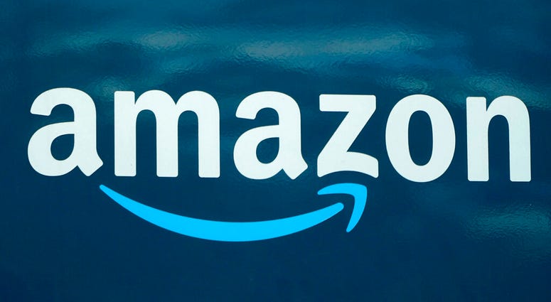 FILE - In this Oct. 1, 2020 file photo, an Amazon logo appears on an Amazon delivery van, in Boston. (AP Photo/Steven Senne, File) FILE - In this Oct. 1, 2020 file photo, an Amazon logo appears on an Amazon delivery van, in Boston. (AP Photo/Steven Senne, File)