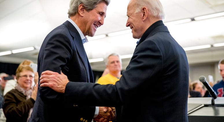 FILE - In this Feb. 1, 2020, file photo Democratic presidential candidate former Vice President Joe Biden smiles as former Secretary of State John Kerry, left, takes the podium to speak. (AP Photo/Andrew Harnik, File) FILE - In this Feb. 1, 2020, file photo Democratic presidential candidate former Vice President Joe Biden smiles as former Secretary of State John Kerry, left, takes the podium to speak. (AP Photo/Andrew Harnik, File)