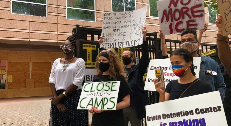 FILE - In this Sept. 15, 2020, file photo, Dawn Wooten, left, a nurse at Irwin County Detention Center in Ocilla, Georgia, speaks at a news conference in Atlanta protesting conditions at the immigration jail. (AP Photo/Jeff Amy, File) FILE - In this Sept. 15, 2020, file photo, Dawn Wooten, left, a nurse at Irwin County Detention Center in Ocilla, Georgia, speaks at a news conference in Atlanta protesting conditions at the immigration jail. (AP Photo/Jeff Amy, File)