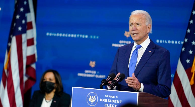 President-elect Joe Biden speaks as Vice President-elect Kamala Harris listens at left. (AP Photo/Andrew Harnik) President-elect Joe Biden speaks as Vice President-elect Kamala Harris listens at left. (AP Photo/Andrew Harnik)