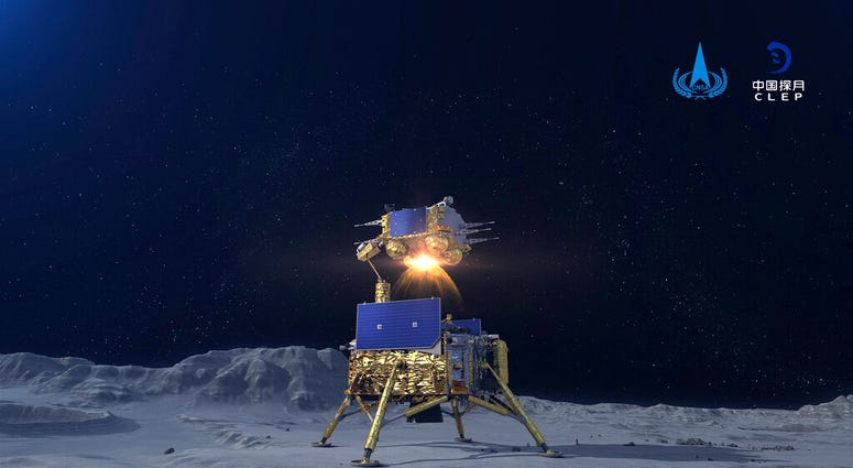 In this China National Space Administration (CNSA) photo released by Xinhua News Agency, a simulated image of the ascender of Chang'e-5 spacecraft blasting off from the lunar surface at the Beijing Aerospace Control Center (BACC) in Beijing on Dec. 3, 202