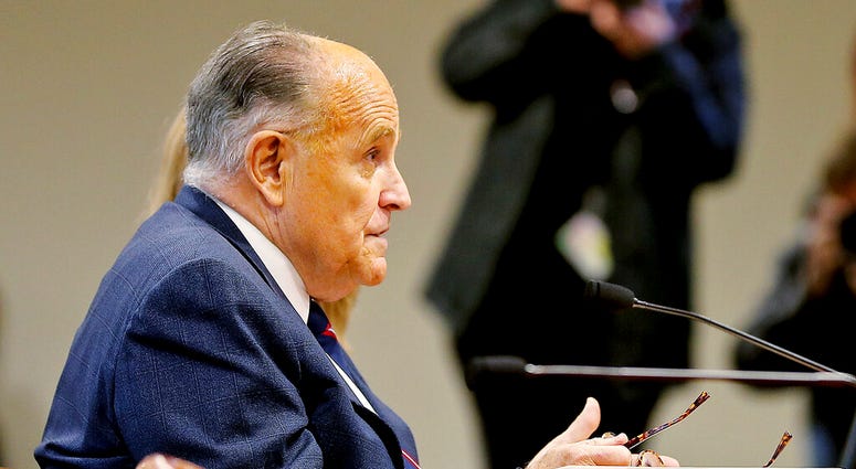 Rudy Giuliani, President Donald Trump's personal attorney, testifies during a Michigan House Oversight Committee hearing for suspicion of voter fraud within the state at the House Office Building in Lansing, Mich., on Wednesday, Dec. 2, 2020.