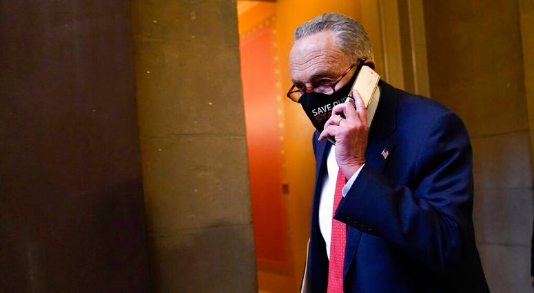 Senate Minority Leader Sen. Chuck Schumer of N.Y., walks on Capitol Hill in Washington, Tuesday, Dec. 15, 2020.