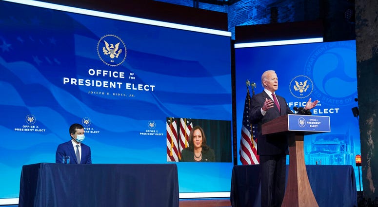 President-elect Joe Biden announces former South Bend, Ind. Mayor Pete Buttigieg as his nominee for transportation secretary during a news conference at The Queen theater in Wilmington, Del.