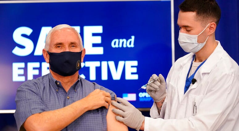 Vice President Mike Pence receives a Pfizer-BioNTech COVID-19 vaccine shot at the Eisenhower Executive Office Building on the White House complex, Friday, Dec. 18, 2020, in Washington.