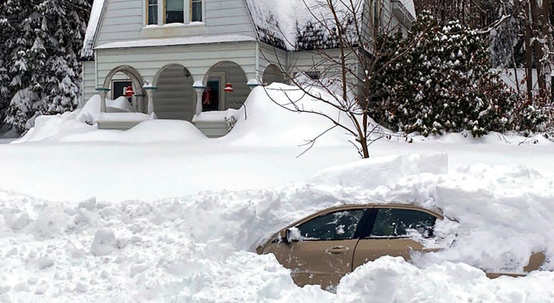 This photo, provided by the New York State Police, shows a car, in Owego, NY, from which a New York State Police sergeant rescued Kevin Kresen, 58, of Candor, NY, stranded for 10 hours