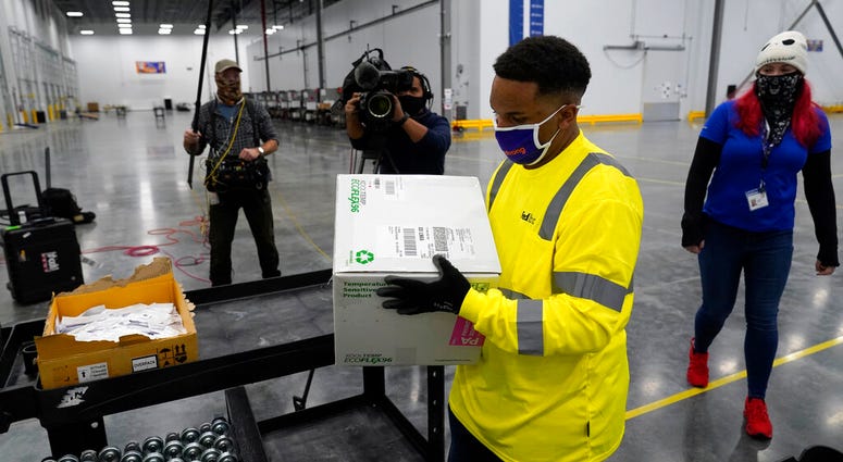 Boxes containing the Moderna COVID-19 vaccine are prepared to be shipped at the McKesson distribution center in Olive Branch, Miss., Sunday, Dec. 20, 2020.
