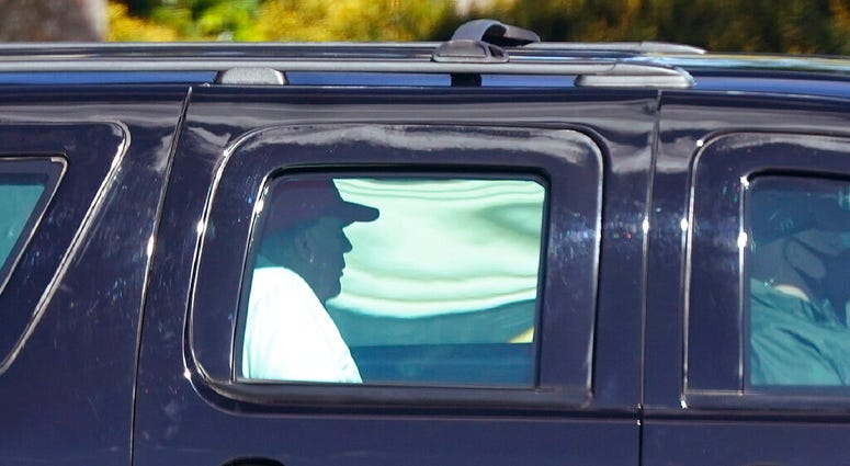 President Donald Trump rides in a motorcade vehicle as he departs Trump International Golf Club, Sunday, Dec. 27, 2020, in West Palm Beach, Fla. (AP Photo/Patrick Semansky) President Donald Trump rides in a motorcade vehicle as he departs Trump International Golf Club, Sunday, Dec. 27, 2020, in West Palm Beach, Fla. (AP Photo/Patrick Semansky)