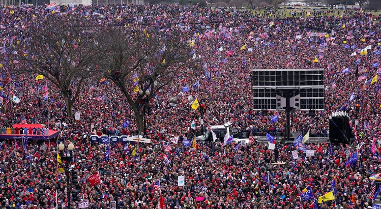 With the Washington Monument in the background, people attend a rally in support of President Donald Trump near the White House on Wednesday, Jan. 6, 2021, in Washington. (AP Photo/Jacquelyn Martin) With the Washington Monument in the background, people attend a rally in support of President Donald Trump near the White House on Wednesday, Jan. 6, 2021, in Washington. (AP Photo/Jacquelyn Martin)